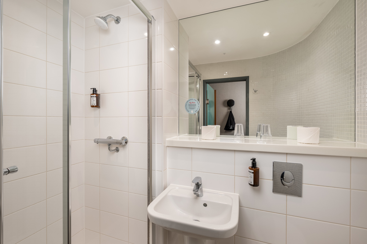 Well-lit accessible twin bedroom designed for comfort and accessibility at Point A Hotel Paddington
